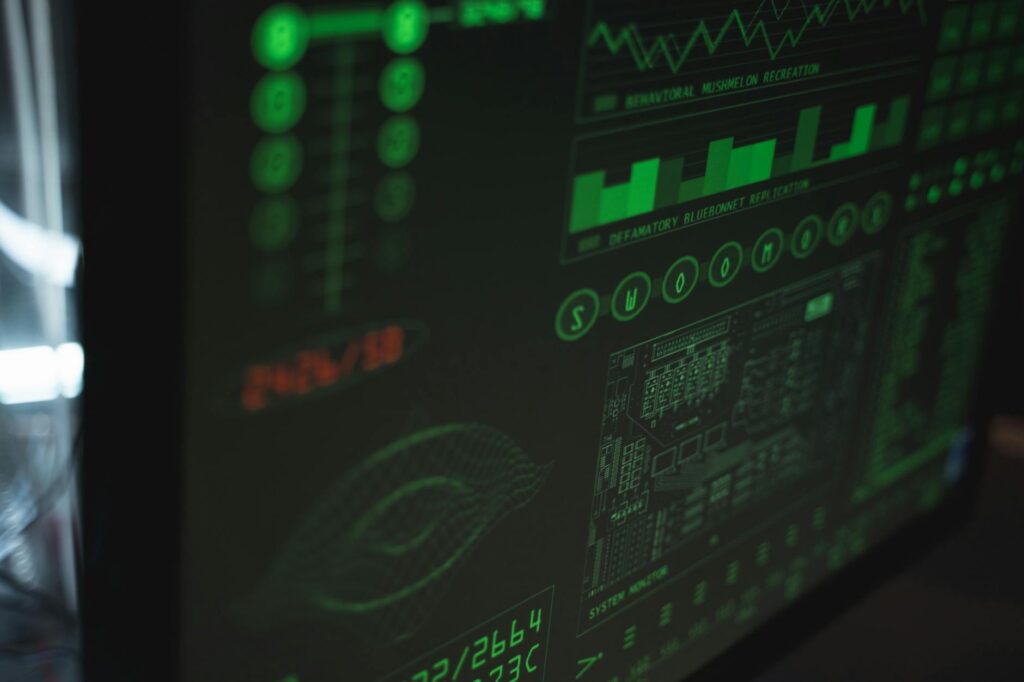 Close-up view of a computer displaying cybersecurity and data protection interfaces in green tones. (Photo by Tima Miroshnichenko on Pexels)