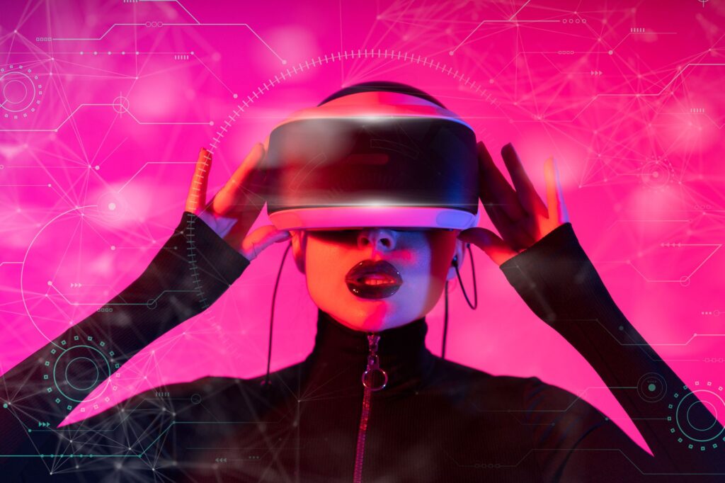 A stylish woman interacts with futuristic VR technology in a vibrant setting. (Photo by Atlantic Ambience on Pexels)
