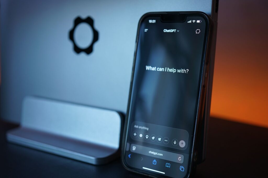 Close-up of a smartphone with AI chat interface, showcasing advanced technology in a sleek design. (Photo by Tim Witzdam on Pexels)